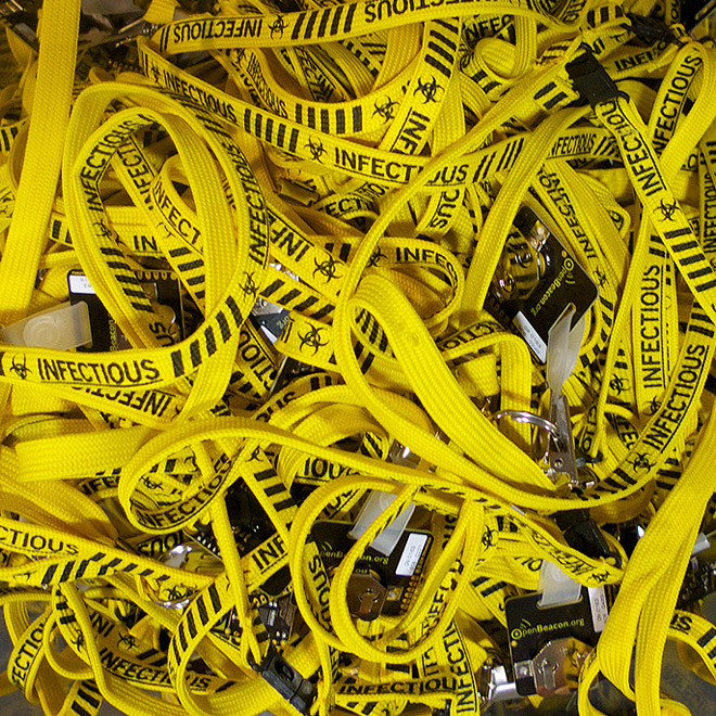 Photo closeup of a bunch of bright yellow lanyards with SocioPatterns badges as used during the INFECTIOUS exhibition in the Science Gallery, spring 2009, Trinity College, Dublin.